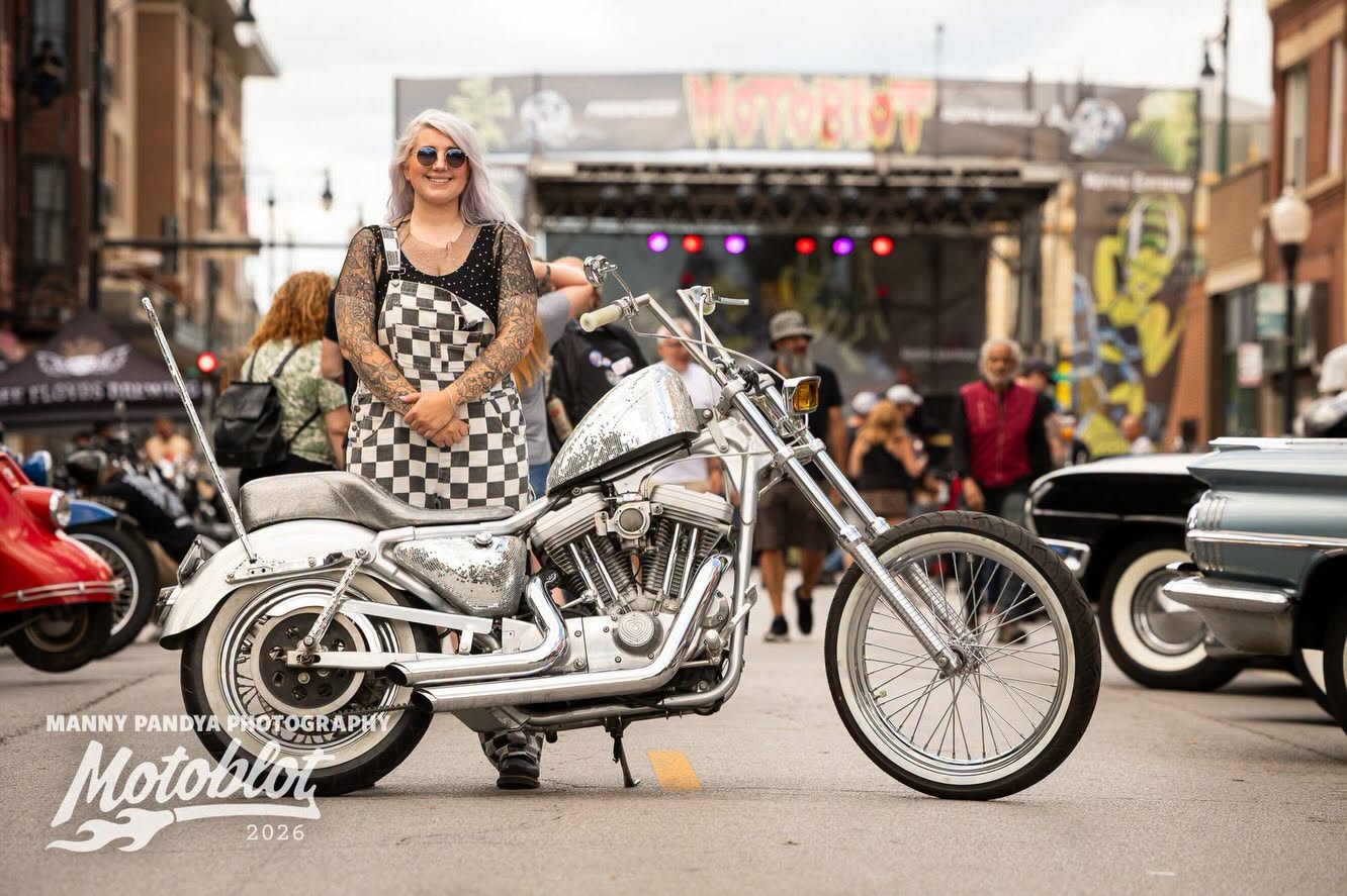 MOTOBLOT Valhalla 2026 winner Morgan Michelle poses with her entry, The Glitterus, a 2001 Harley-Davidson Sportster.